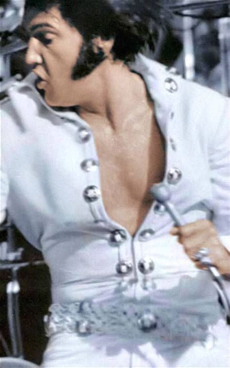 Elvis Presley Singing Into A Microphone In His White Outfit