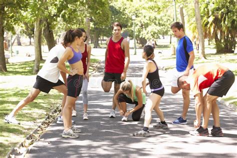 Group Of Runners Warming Up In Park Stock Image Image Of Jogging