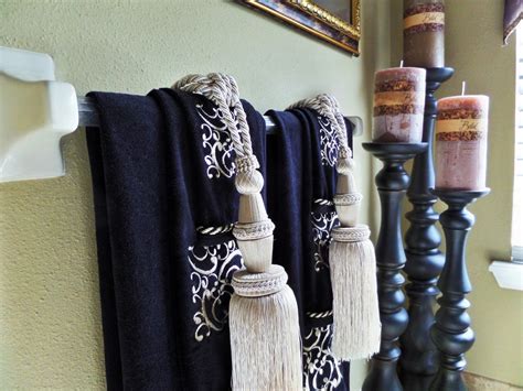 You can hang towels in your bathroom in unique ways to make it look creative and different. Master Bathroom: Tuscan Inspired - Be My Guest With Denise