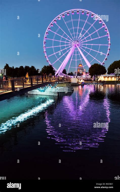 Illuminated Ferris Wheel Observation Wheel In Old Port At The Blue Hour Of A Summer Evening In