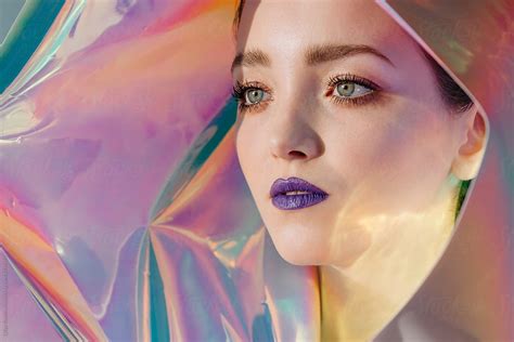 Surreal Portrait Of Young Beautiful Woman With Violet Lips On