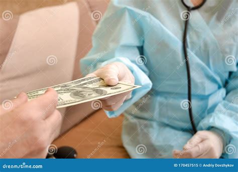 the patient gives the doctor money a bribe for treatment the concept of corrupt doctors stock