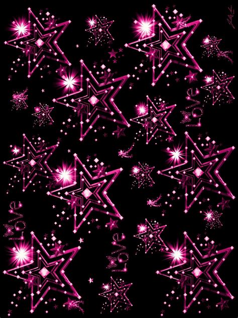 Pink Stars And Sparkles Against A Black Background