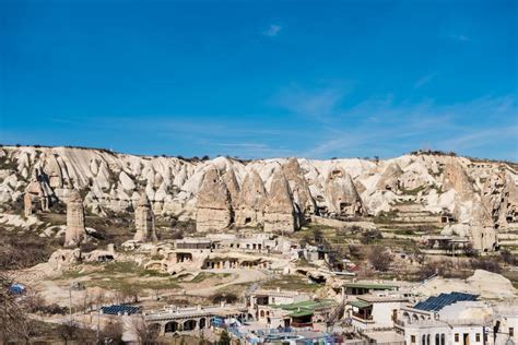 Aerial View Of Goreme Town With Cave Hotel Built In Rock Formation In