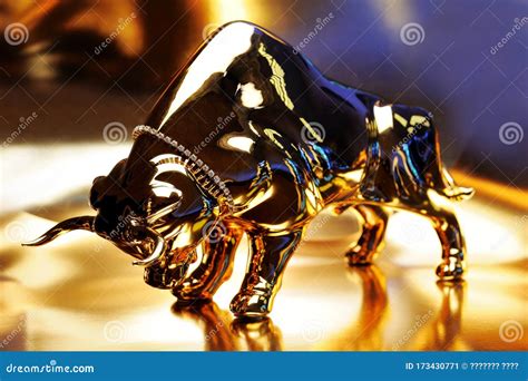Golden Bull Bear Figurine On Gold Bars Stock Photo