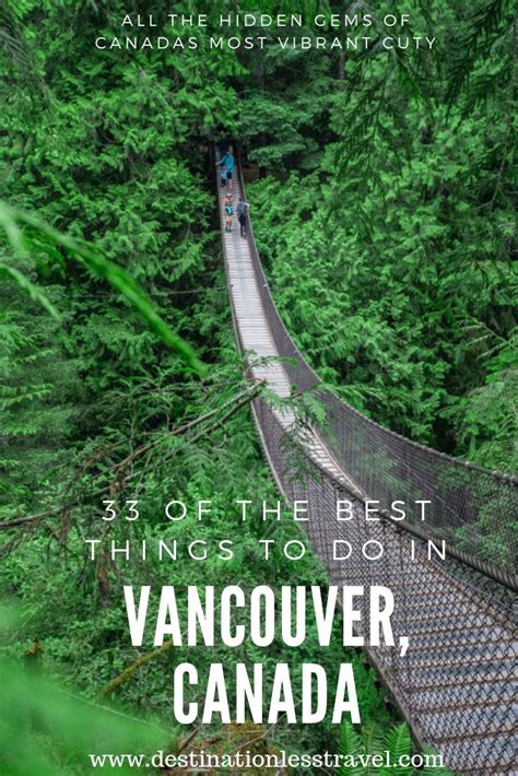 People Walking Across A Suspension Bridge In Vancouver Canada With