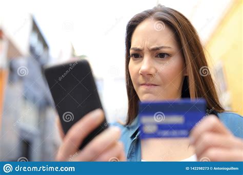 Besides contact details, the page also offers a brief overview of the company. Angry Woman Paying With Credit Card And Phone Outside Stock Image - Image of cellular, buying ...