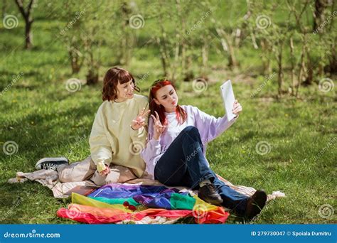 Good Looking Two Ladies Lesbian In The Park Laying Down On The Blanket And Take Some Pictures