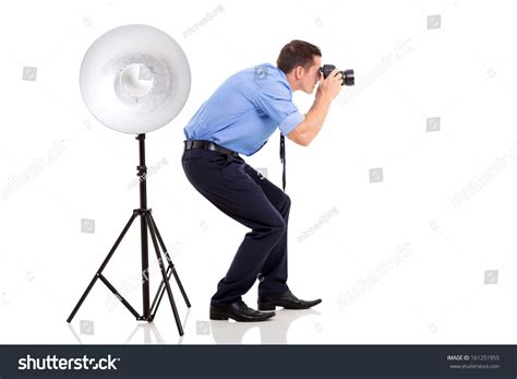 Successful Young Photographer Taking Photos In Studio 161251955