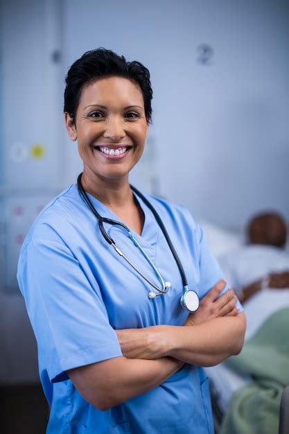 Premium Photo Portrait Of Female Nurse Standing In Ward