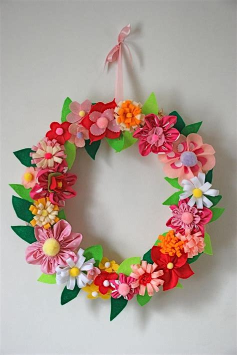 A Paper Flower Wreath Hanging On The Wall