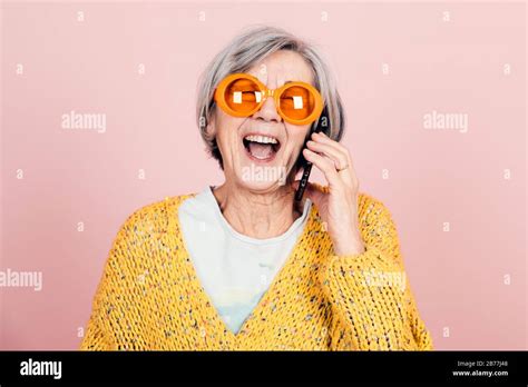 Happy Young Style Elderly Grandma With Orange Sunglasses And Modern