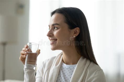 Smiling Young Woman Hold Glass With Clean Mineral Water Stock Image
