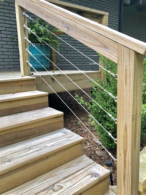 The heavy 2x6 wood cap rail and 2x4 bottom rail and post make a robust looking frame. Cable Railing: DIY Modern Deck railing tutorial - | Deck ...