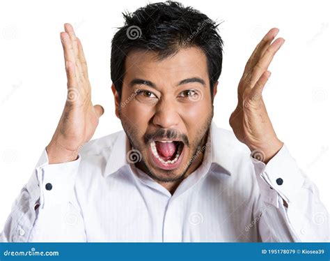 Portrait Of An Angry Man With Hands In Air Wide Open Mouth Yelling