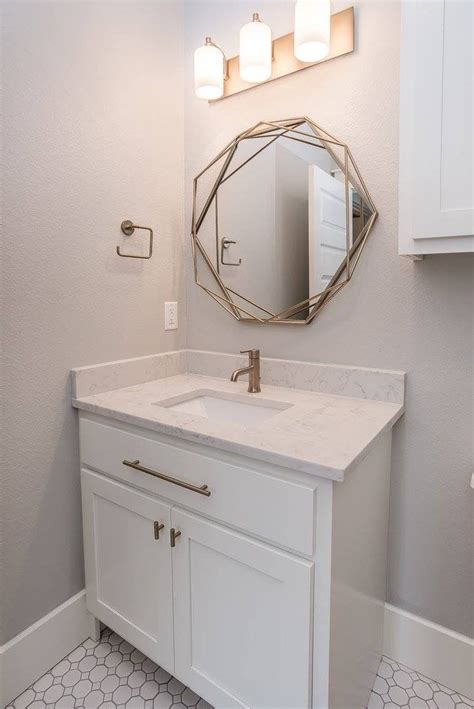 These fixtures are a softer. Powder bath with white custom Shaker bathroom cabinets ...