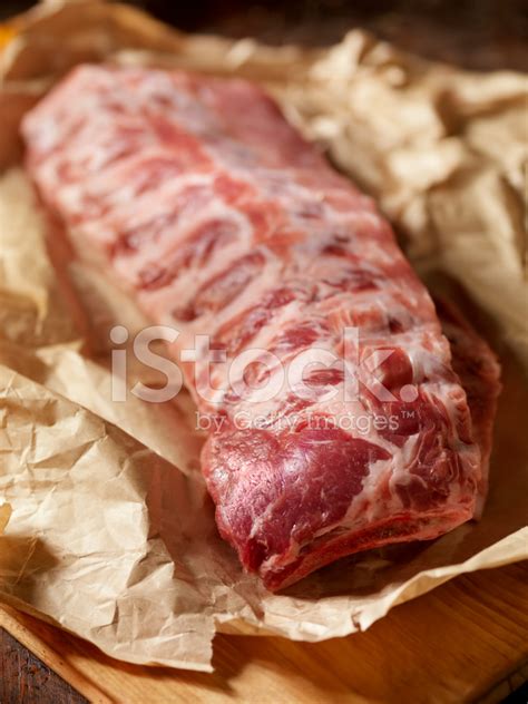 Raw Baby Back Pork Ribs In Butcher Paper Stock Photos