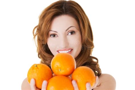 Portrait Of A Happy Woman Holding Oranges Stock Photo Image Of