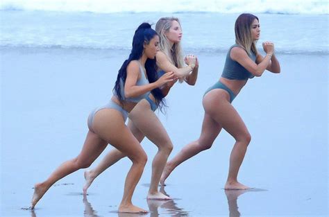 Kim Kardashian Slips Into A Bikini To Get Some Beach Workout With Her