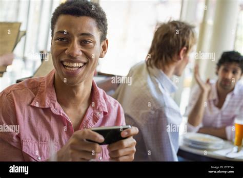 Three People Talking One Black Hi Res Stock Photography And Images Alamy