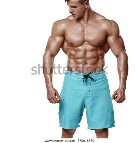 Sexy Athletic Man Showing Muscular Body And Sixpack Abs Isolated Over