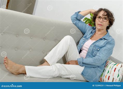 Beautiful Mature Woman Lying On The Sofa Stock Image Image Of Mature Couch 72399231