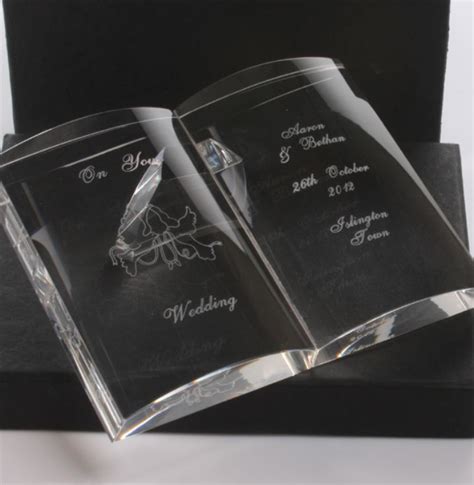Everywhere, it seems, except for on paper, actually in our hands. Personalised Crystal Wedding Open Book | The Gift Experience