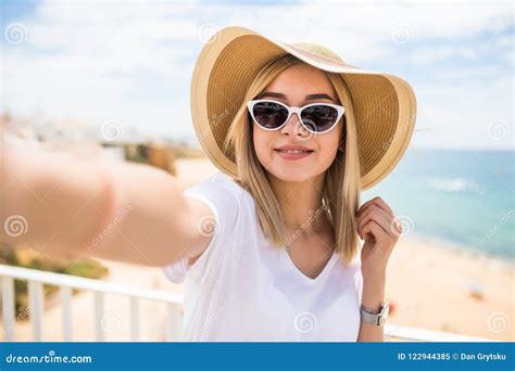 Beautiful Woman In Sunglasses And Summer Hat Taking Selfie On Beach Stock Image Image Of
