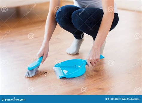 Close Up Of Woman With Brush And Dustpan Sweeping Stock Photo Image