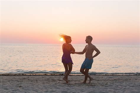 Couple Dancing At Sunset By Stocksy Contributor Mosuno Stocksy