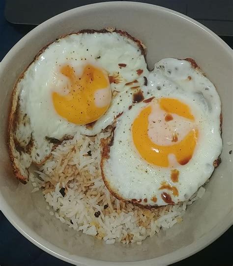 Filipino Silog Garlic Fried Rice And Fried Eggs With A Splash Of Soy Sauce R Putaneggonit