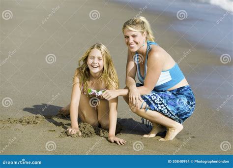 Mother And Daughter Together On Beach Stock Photo Image Of Coast Clothing
