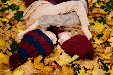 Little Girls In Hat Lying On Yellow Autumn Leaves Stock Image Image