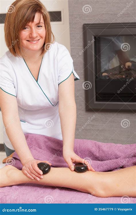 Beauty Salon Woman Getting Spa Hot Stone Legs Massage Stock Image