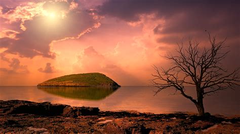 3840x2160 Surreal Sunrise Near Ocean Lighthouse 4k Wallpaper Hd Nature