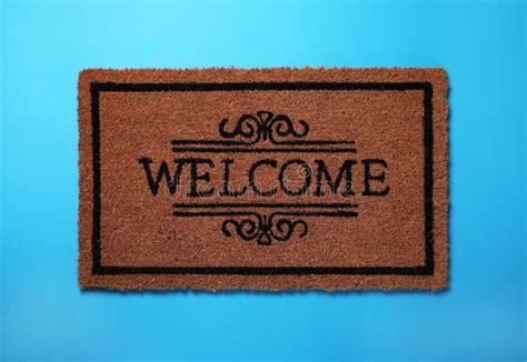Doormat With Word Welcome On Light Blue Background Top View Stock