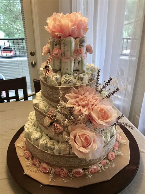 Learn how to make a diaper cake or adorable baby shower gifts here. Diaper Cake Rustic pink roses, lavender, baby's breathe ...