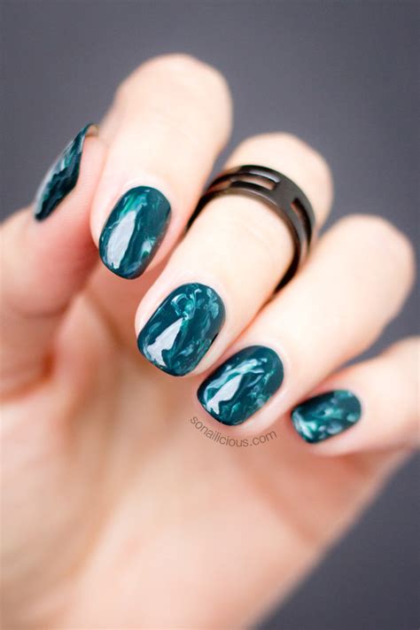 Asking for individuality and style is what we all ask for. Green Marble Nails Mani Monday