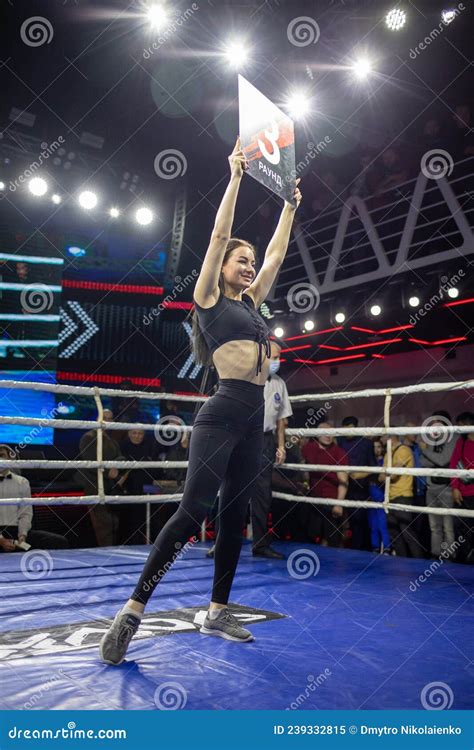 Boxing Ring Girl Holding A Board With Round Number During Boxing