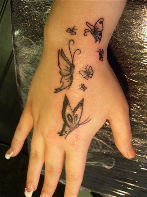 Tribal tattoo on right side hand. Butterfly Tattoos On Hand