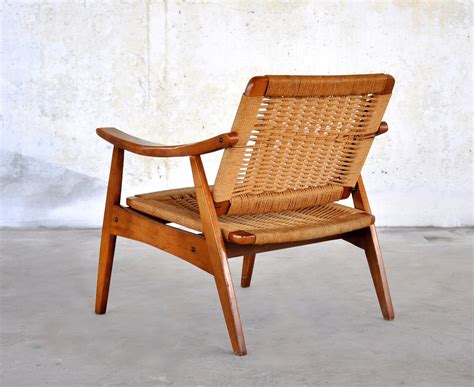 Commonly made of wood, the rocking chair was invented in the early 1700s and originally used in gardens. SELECT MODERN: Hans Wegner Style Rope Lounge Chair
