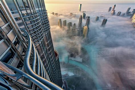 Aerial View Of Cityscape With Skyscrapers Above The Clouds
