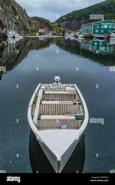 Small Boats Docked At The Small Harbor Of Quidi Vidi In Front Of