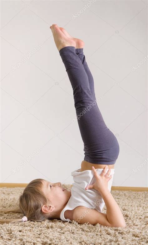 Cute Little Girl Yoga Exercising — Stock Photo © Petrograd99 39947621