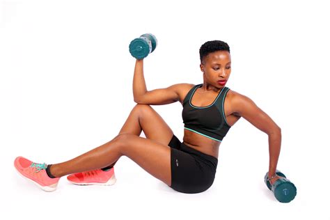 Fit Athletic Woman Exercising With Dumbbells