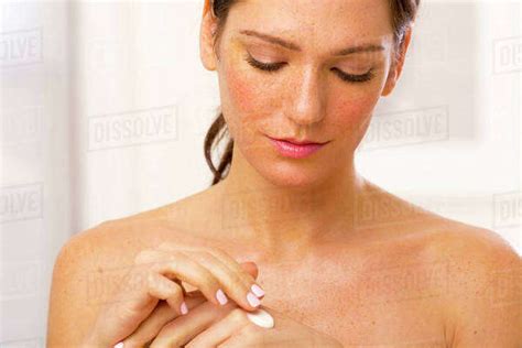 Caucasian Woman Applying Lotion Stock Photo Dissolve