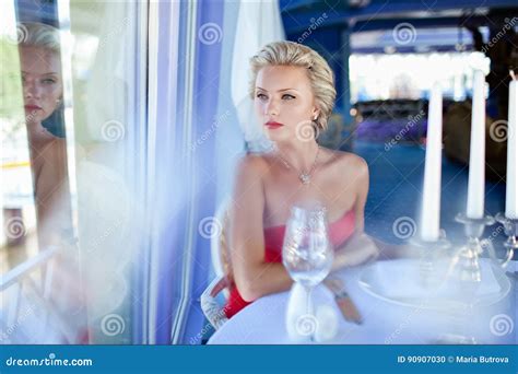 Beautiful Elegant Exquisite Blonde Girl In Red Dress Sitting At Stock Photo Image Of Female