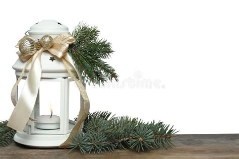 Christmas Lantern With Burning Candle And Fir Branches On Wooden Table