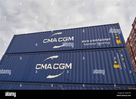 Close Up Of Some Blue Cma Cgm Eco Shipping Containers Stacked Up In Den