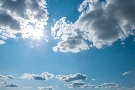 Beautiful Blue Summer Sky With Fluffy Clouds And Bright Sun As A